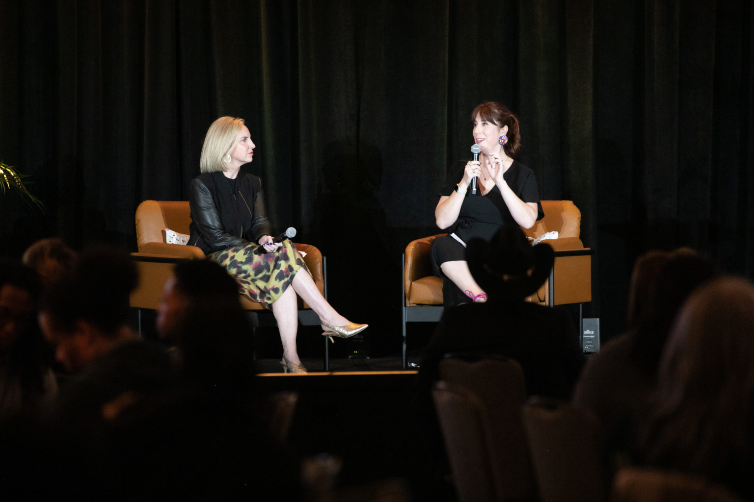 Amanda Zamora and Emily Ramshaw on stage at the LION Local Journalism Awards ceremony