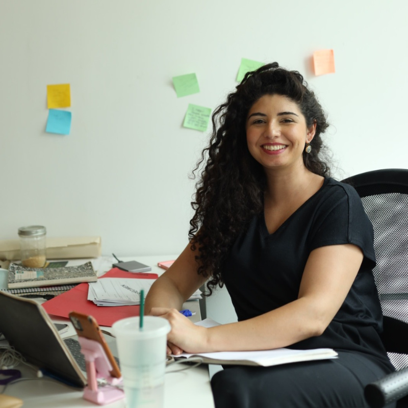 Lela Savic sitting at her desk